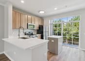 Thumbnail 2 of 48 - Davey Two Bedroom Townhome - renovated kitchen with island and nice views