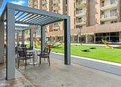 Thumbnail 36 of 82 - Bistro seating to enjoy the Virginia breezes in The Plaza at Trillium Apartments, Fairfax, Virginia