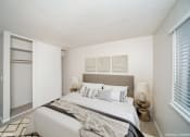 Thumbnail 20 of 40 - Bedroom with a large bed and a window  at Avery Park in Englewood, CO