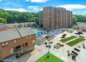 Thumbnail 31 of 82 - New plaza with fire pit, games, hammocks, grills and MORE! at Trillium Apartments, Virginia