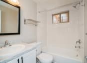 Thumbnail 11 of 30 - Sparkling White Bathroom with Updated Cabinets at 1443 Elizabeth