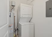 Thumbnail 12 of 42 - A white oven and fridge in a small kitchen.