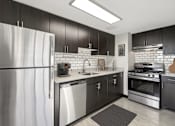 Thumbnail 2 of 50 - Modern kitchen with stainless steel appliances