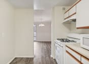 Thumbnail 8 of 82 - CLASSIC - Kitchen with view into the dining area at Trillium in Fairfax, VA