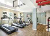 Thumbnail 31 of 40 - Fitness center with treadmills and other exercise equipment  at Avery Park in Englewood, CO
