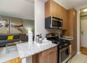 Thumbnail 2 of 30 - One bedroom model kitchen at Bridgeyard in Alexandria, VA
