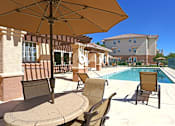 Thumbnail 17 of 26 - Lovely pool deck with seating at Canon de Arrowhead in Albuquerque, New Mexico