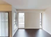 Thumbnail 45 of 82 - Vynle plank flooring and floor to ceiling windows at Trillium Apartments, Fairfax