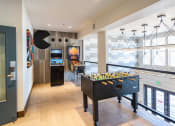 Thumbnail 11 of 25 - a games room with a foosball table and other games in a building