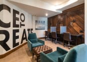 Thumbnail 14 of 25 - a conference room with a table and chairs and a wall with a sign