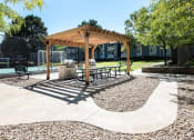 Thumbnail 25 of 40 - Picnic area with benches and a picnic table  at Avery Park in Englewood, CO
