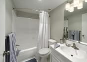 Thumbnail 29 of 82 - PLATINUM upgrade bright white bathrooms with a tub at Trillium Apartments, Virginia