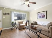 Thumbnail 5 of 20 - a living room with a couch and a table
