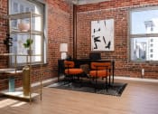 Thumbnail 6 of 21 - a room with chairs and a clock on a brick wall