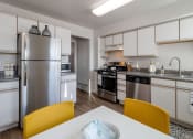 Thumbnail 15 of 61 - Townhome kitchen with stainless steel appliances