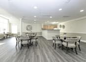 Thumbnail 2 of 28 - Large community room area for residents to enjoy with plenty of seating.