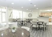 Thumbnail 3 of 28 - Large community room area for residents to enjoy with plenty of seating.
