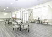Thumbnail 6 of 28 - Large community room area for residents to enjoy with plenty of seating.