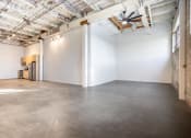 Thumbnail 38 of 57 - an empty room with white walls and a cement floor