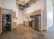 Thumbnail 47 of 57 - a kitchen with a washing machine and a refrigerator
