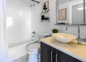 Thumbnail 10 of 24 - a bathroom with a sink and a toilet