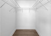 Thumbnail 9 of 24 - a room with white walls and a wood floor