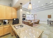 Thumbnail 19 of 34 - Modern clubhouse kitchen area at Stonehaven Apartments in Houston, TX
