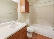 Thumbnail 31 of 34 - Spacious bathroom with tiled bath and large vanity Stonehaven Apartments in Houston, TX