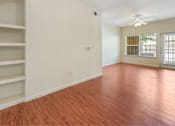 Thumbnail 23 of 34 - Large open living area with plenty of natural lighting and beautiful flooring at Stonehaven Apartments in Houston, TX
