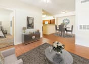 Thumbnail 3 of 34 - Spacious living room with wood-like plank flooring  at Stonehaven Apartments in Houston, TX