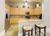 Thumbnail 18 of 34 - Modern clubhouse kitchen area at Stonehaven Apartments in Houston, TX