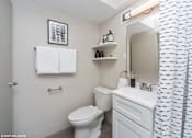 Thumbnail 15 of 50 - Upgraded bathroom with bright lighting at Archer Tower in Denver, CO