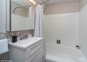 Thumbnail 16 of 50 - Full size tub in the modern bathroom at Archer Tower in Denver, CO