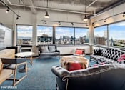 Thumbnail 39 of 50 - Penthouse entertainment lounge with comfortable seating at Archer Tower in Denver, CO