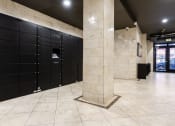Thumbnail 17 of 19 - a row of black lockers in a building with a marble pillar