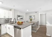 Thumbnail 5 of 32 - Open concept kitchen with stainless steel appliances at The Crossings at Russett in Laurel, MD