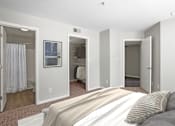 Thumbnail 7 of 32 - Primary bedroom with convenient private bathroom access and a large closet  at The Crossings at Russett in Laurel, MD