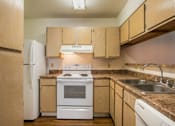 Thumbnail 3 of 41 - Spacious kitchen with all white appliances