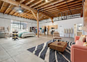 Thumbnail 25 of 57 - A room with a wooden ceiling and a rug on the floor.