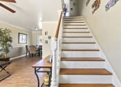Thumbnail 9 of 20 - a staircase in a house with a wooden railing