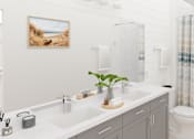 Thumbnail 14 of 14 - A bathroom with a white sink, toilet, and shower.