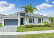 Thumbnail 1 of 37 - a white house with a palm tree in front of it
