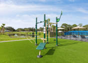 Thumbnail 33 of 37 - a park with a playground and a swimming pool