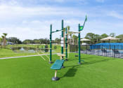 Thumbnail 30 of 37 - a park with a playground and a swimming pool