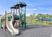 Thumbnail 29 of 37 - a playground with a slide and climbing equipment in a park