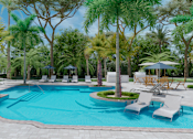 Thumbnail 2 of 14 - A pool surrounded by palm trees and lounge chairs.