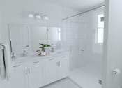 Thumbnail 11 of 14 - A white bathroom with a sink, mirror, and bathtub.