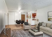 Thumbnail 2 of 25 - a living room with a couch and a chair and a dining room at Pheasant Park Apartments, Minnesota, 55428-5401