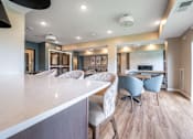 Thumbnail 36 of 44 - a resident clubhouse with a kitchen and dining area at Sonder Point 50+ Apartments, Brooklyn Center, MN