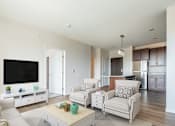 Thumbnail 1 of 44 - a living room with white furniture and a flat screen tv at Sonder Point 50+ Apartments, Brooklyn Center, 55430